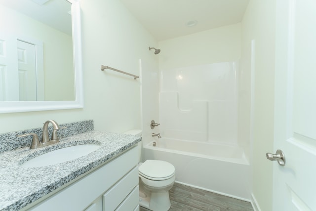 full bathroom with vanity, shower / bath combination, wood finished floors, and toilet