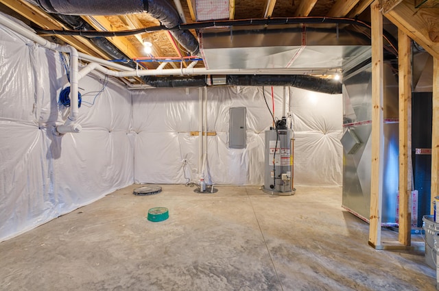 unfinished basement with gas water heater, electric panel, and heating unit