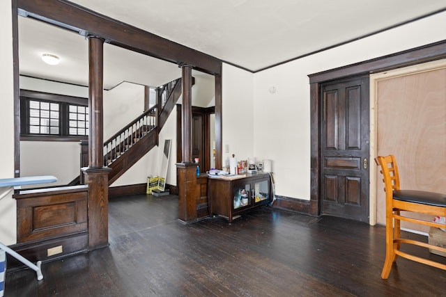 entrance foyer with wood-type flooring, stairway, and baseboards