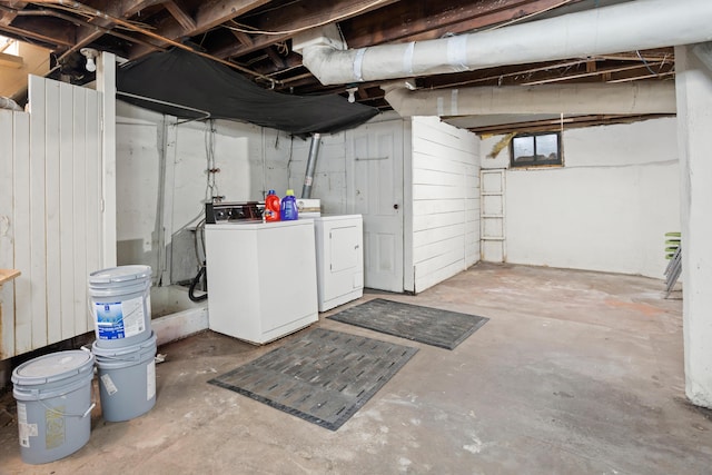 unfinished below grade area featuring washer and clothes dryer