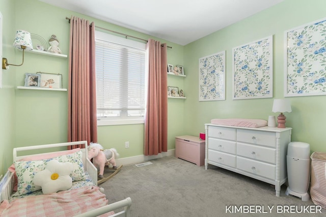 bedroom featuring baseboards, visible vents, and light colored carpet