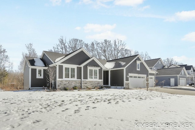 craftsman inspired home with a garage, stone siding, and board and batten siding