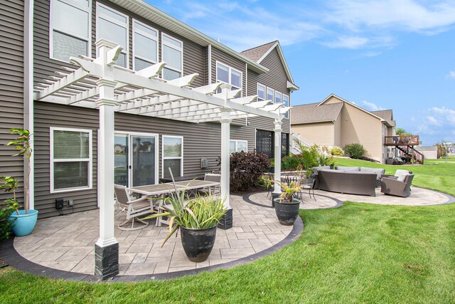 rear view of property featuring outdoor dining area, outdoor lounge area, a lawn, a pergola, and a patio area