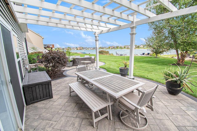 view of patio / terrace with a water view, outdoor dining area, and a pergola