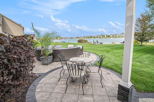 view of patio featuring outdoor dining space and a water view