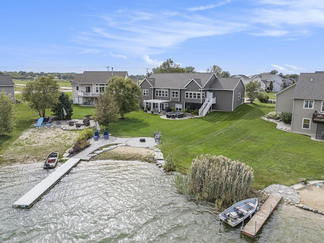 birds eye view of property featuring a residential view and a water view