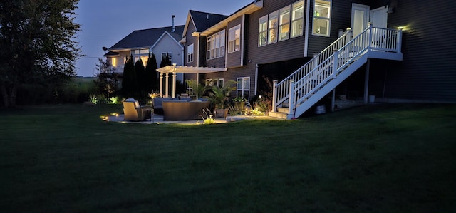 exterior space featuring stairway, a pergola, a lawn, and a patio