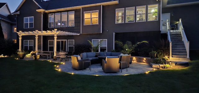 back of house featuring outdoor lounge area, stairs, a lawn, a pergola, and a patio area