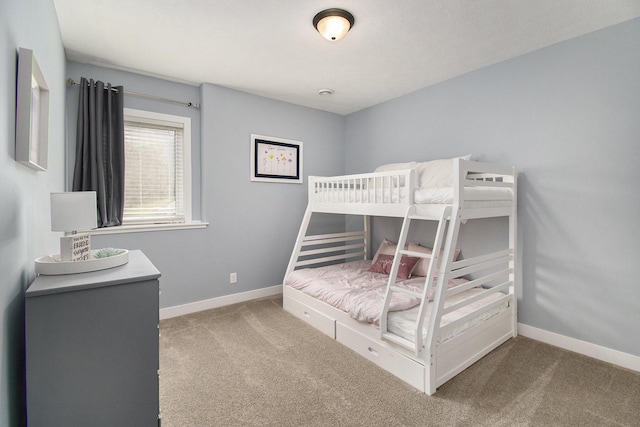 unfurnished bedroom with carpet floors and baseboards