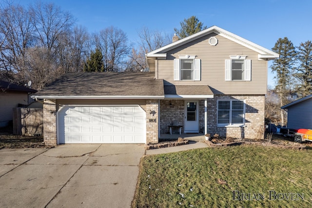 traditional home featuring brick siding, a shingled roof, a garage, driveway, and a front lawn