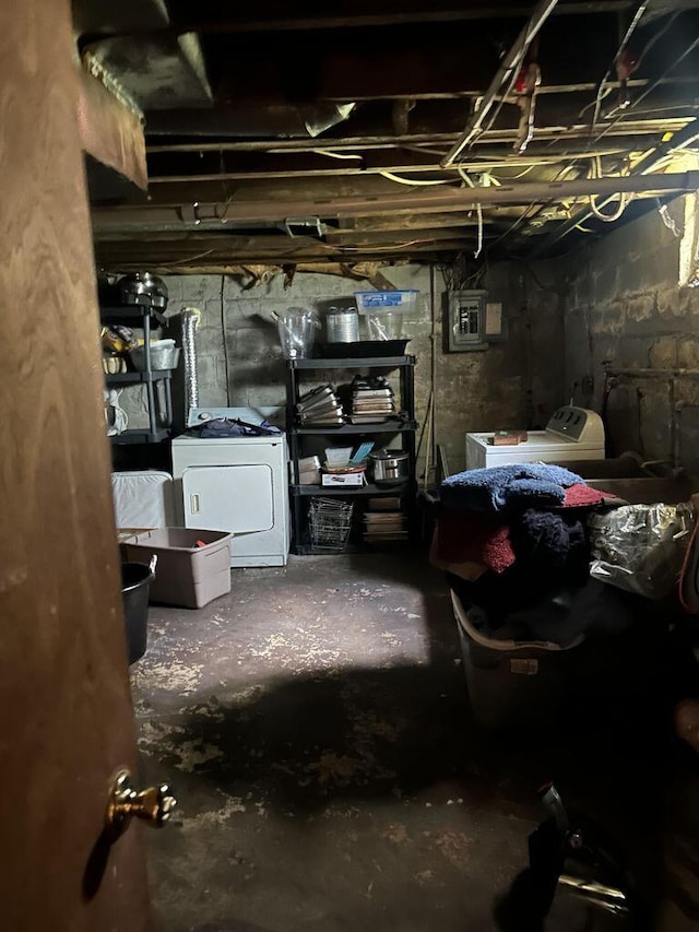 unfinished basement with washer and clothes dryer