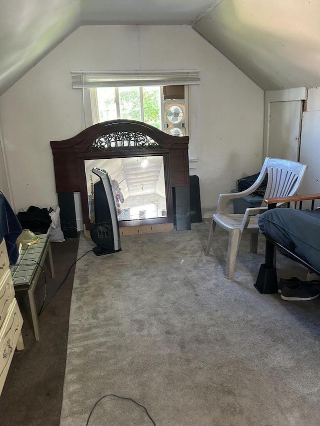 carpeted bedroom featuring vaulted ceiling