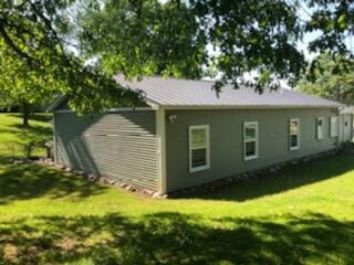 view of home's exterior featuring a yard