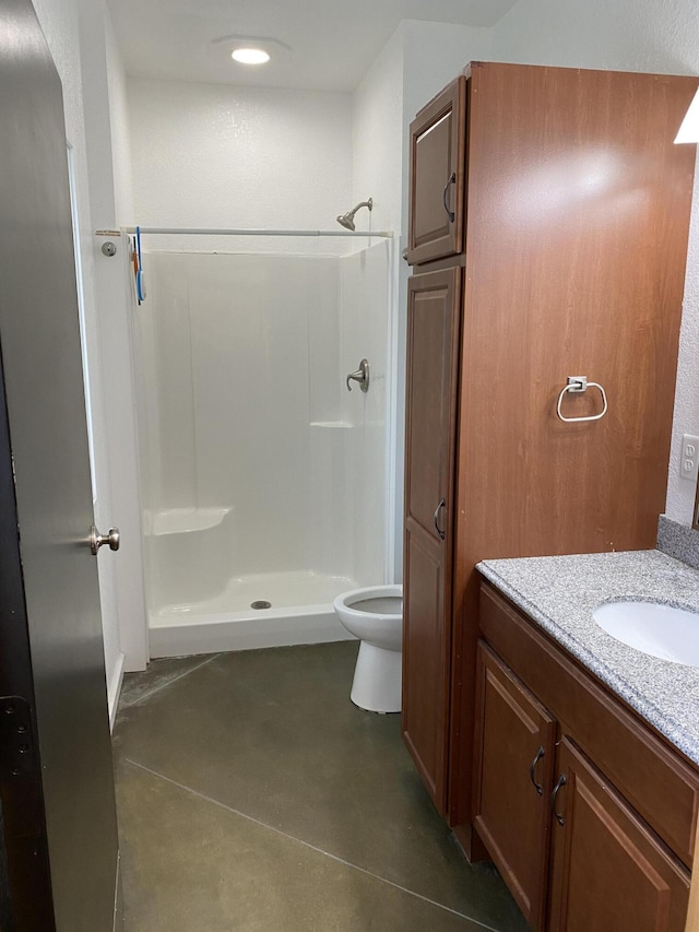 full bath with recessed lighting, toilet, finished concrete floors, a stall shower, and vanity