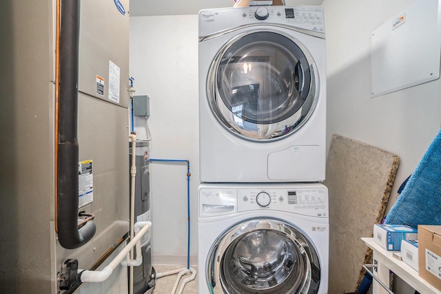 clothes washing area featuring laundry area and stacked washer and dryer