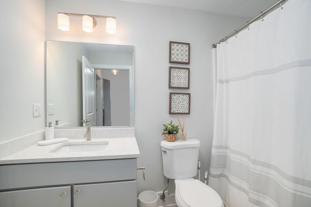 full bathroom featuring vanity and toilet