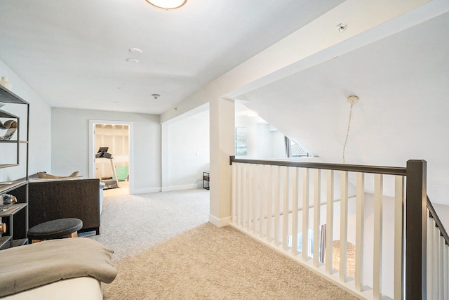 living area with light carpet and baseboards