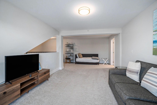 living room featuring light carpet and vaulted ceiling