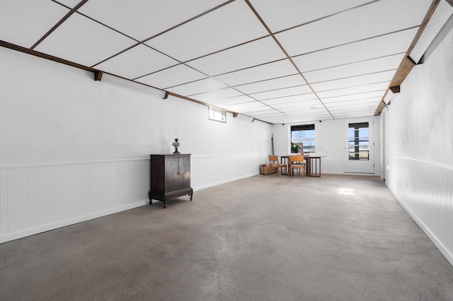 basement featuring a drop ceiling