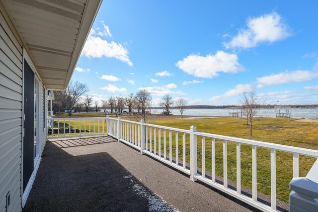 balcony featuring a water view