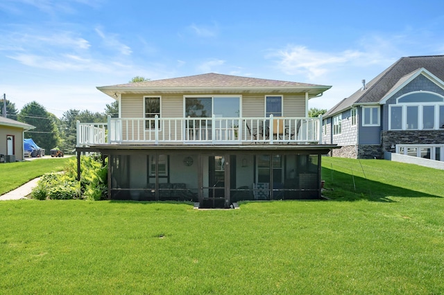 7585 S Indian Lake Dr, Vicksburg, MI 49097 - rear view of property featuring a sunroom, a lawn, and a deck