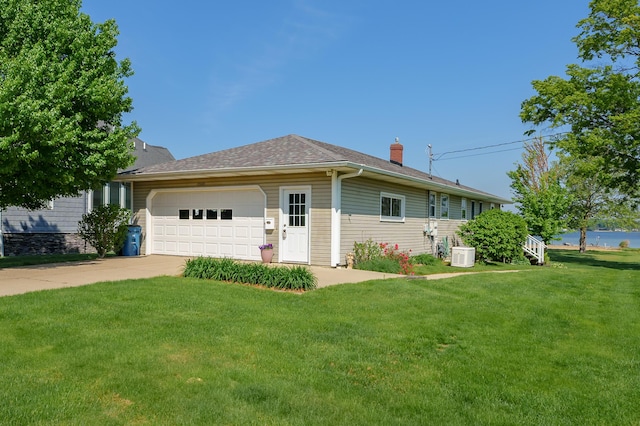 7585 S Indian Lake Dr, Vicksburg, MI 49097 - ranch-style house featuring a garage, a chimney, a front lawn, driveway, and central AC unit