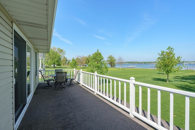 7585 S Indian Lake Dr, Vicksburg, MI 49097 - balcony featuring a water view and outdoor dining space