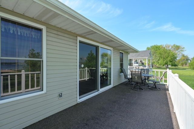 7585 S Indian Lake Dr, Vicksburg, MI 49097 - balcony featuring outdoor dining area