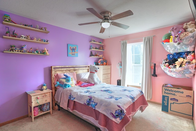 bedroom with carpet, ceiling fan, and baseboards