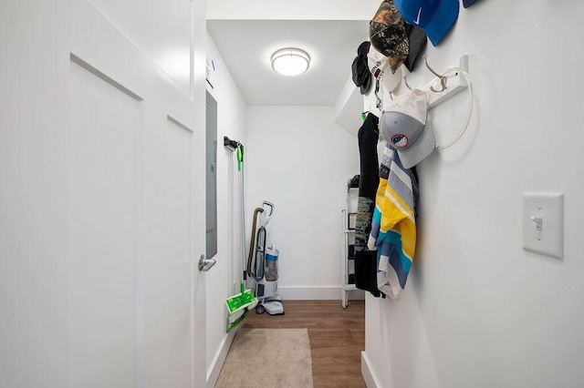 interior space with baseboards and wood finished floors