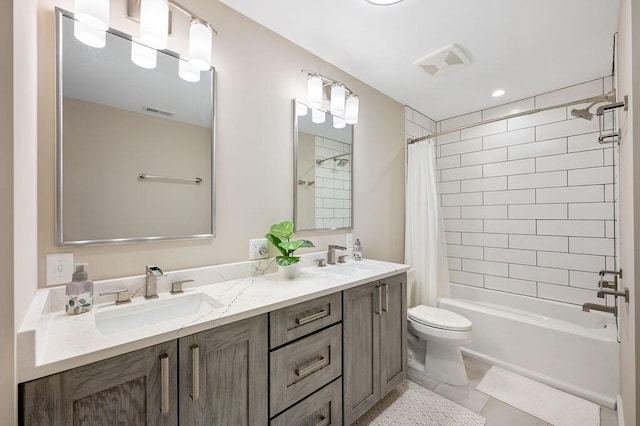 full bath featuring shower / tub combo, visible vents, and a sink