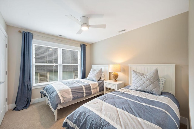 bedroom with visible vents, baseboards, ceiling fan, and carpet flooring