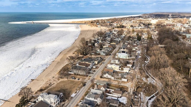 bird's eye view featuring a water view and a view of the beach