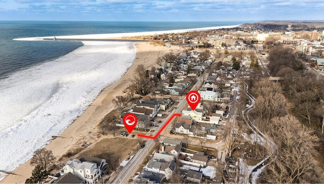 aerial view featuring a water view and a beach view