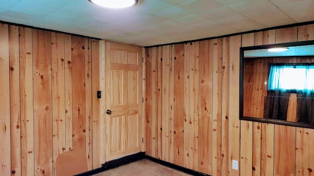 spare room with wooden walls