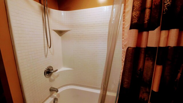 full bath featuring shower / bathtub combination with curtain