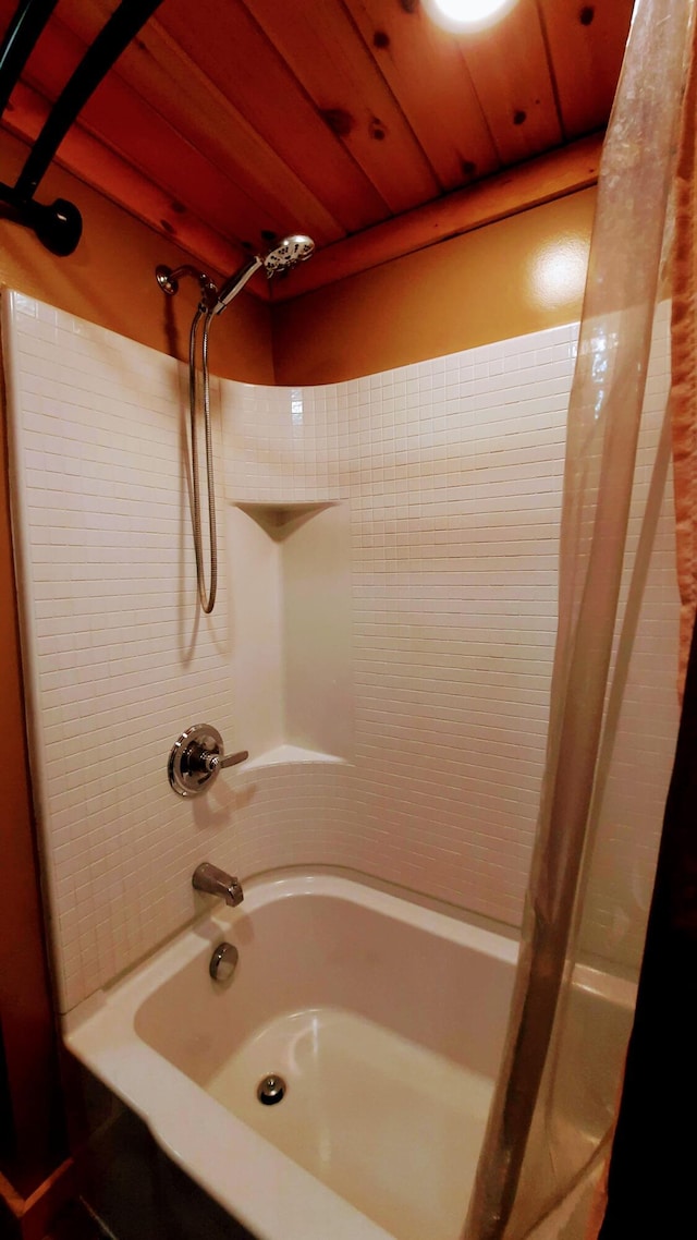 bathroom with wood ceiling and shower / tub combo with curtain