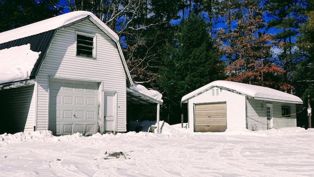 view of snow covered garage