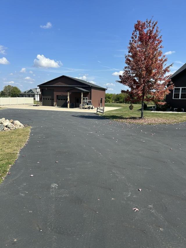 exterior space with aphalt driveway