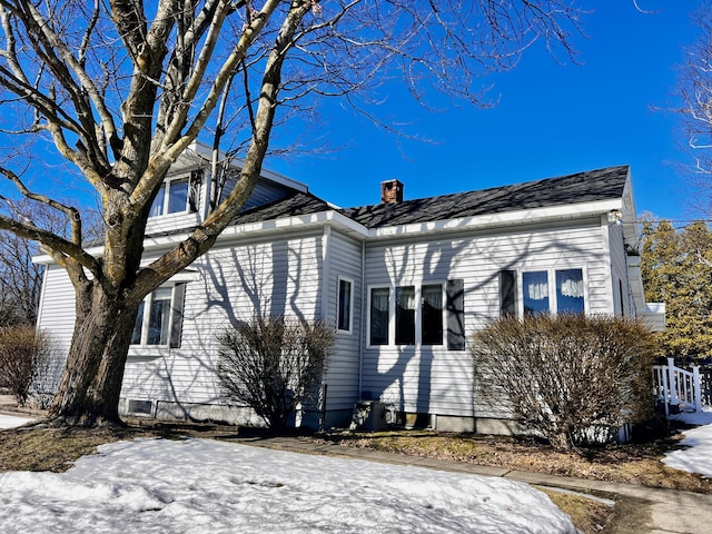 view of front of home featuring a chimney