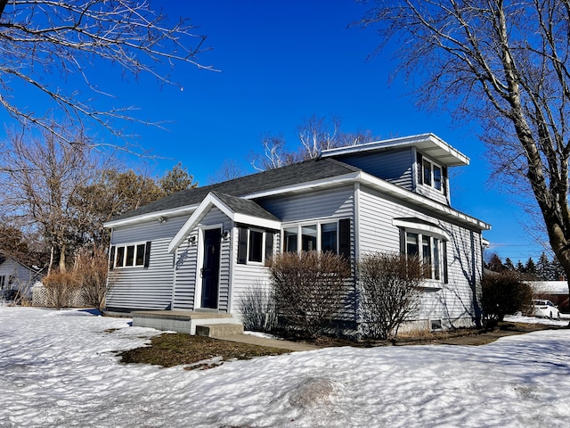 view of front facade with a shingled roof