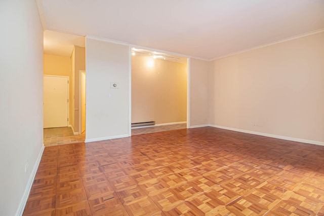 spare room featuring baseboards, crown molding, and baseboard heating