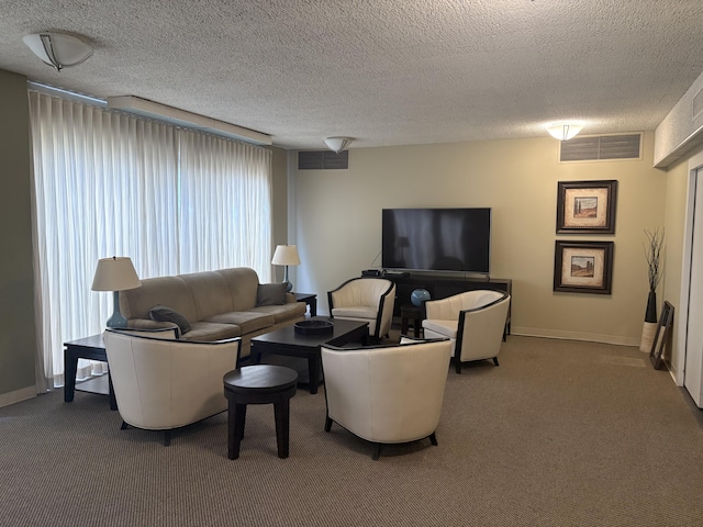 living room featuring a textured ceiling, visible vents, and carpet flooring