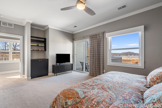 carpeted bedroom featuring access to outside, ornamental molding, visible vents, and baseboards
