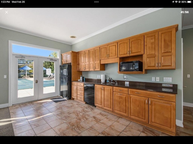 kitchen with french doors, crown molding, dark countertops, a sink, and black appliances