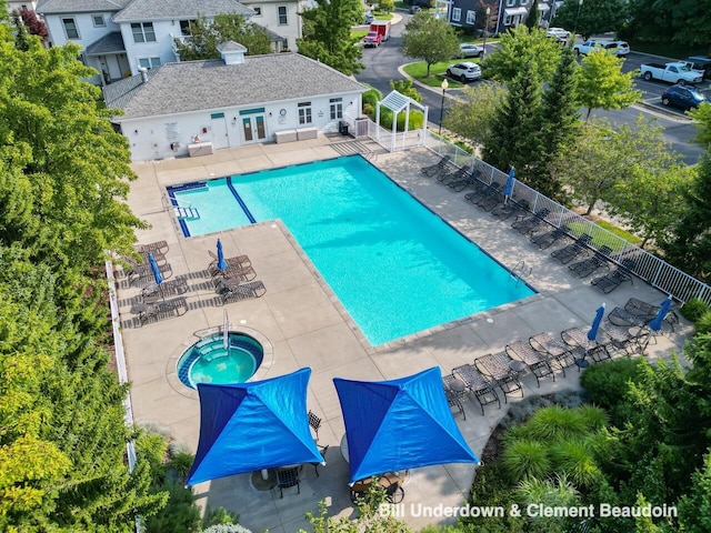 pool featuring a hot tub, a patio area, fence, and a pergola