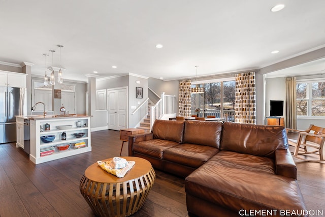 living room featuring dark wood-style floors, ornamental molding, stairway, and recessed lighting