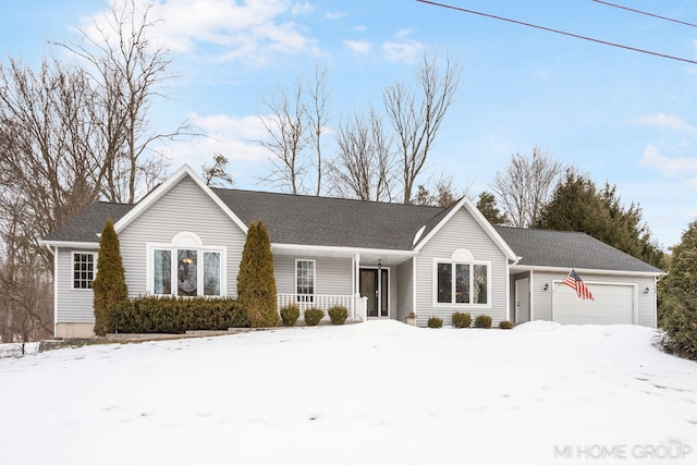 single story home with a garage and covered porch