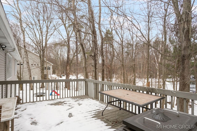 view of snow covered deck