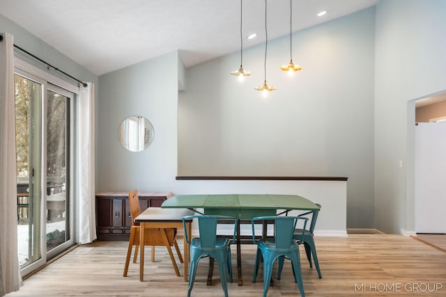 dining space with light wood-style floors, recessed lighting, and baseboards